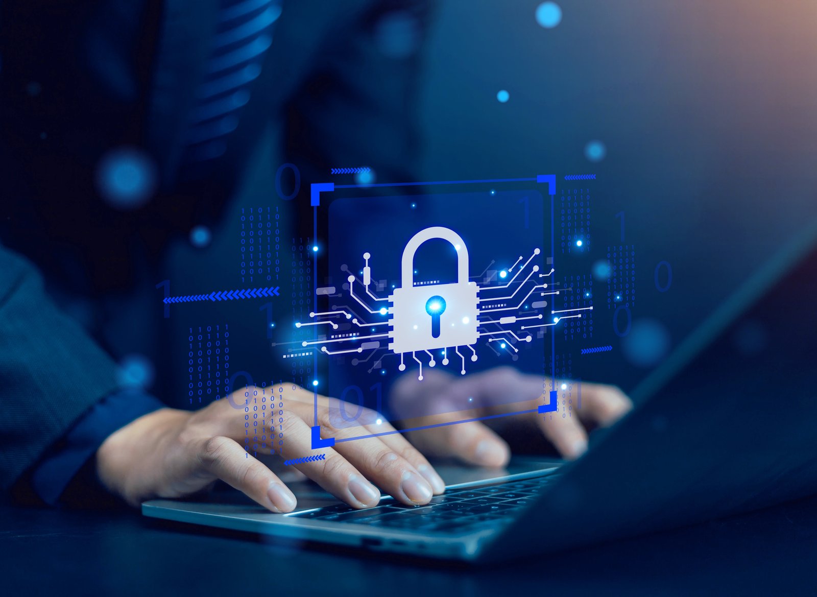 IT security professional typing on a laptop with a digital padlock overlay, representing cybersecurity protection